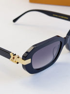 Louis Vuitton glasses with dark navy frames, curved temples, and tinted lenses