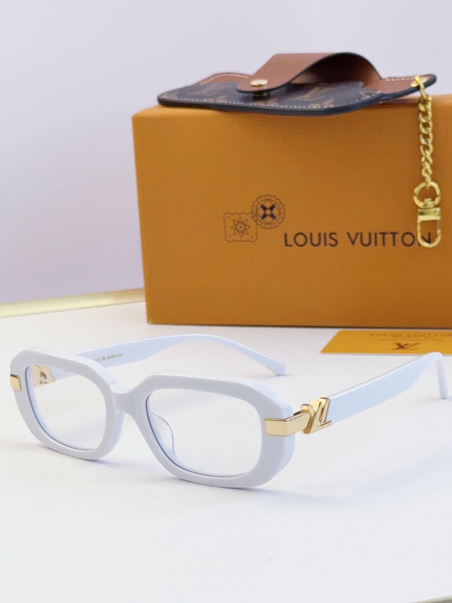 Louis Vuitton glasses with light blue frames and clear lenses