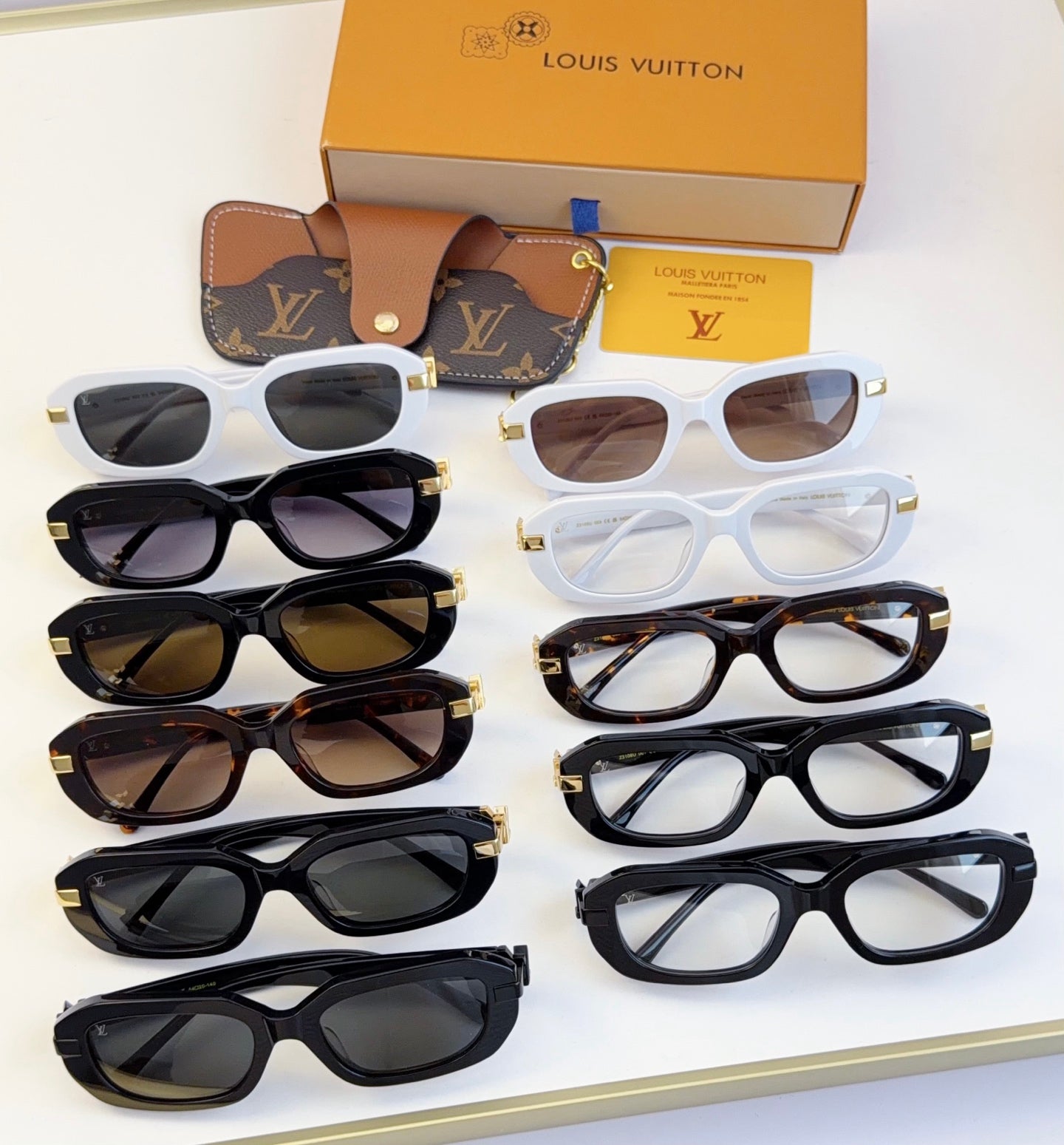 Louis Vuitton glasses assortment with dark, white, and tortoiseshell frames