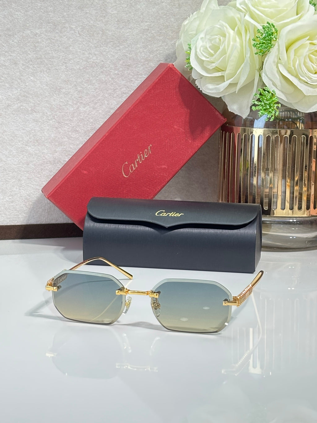 Cartier sunglasses with gold-tone metal frame and light yellow tinted lenses