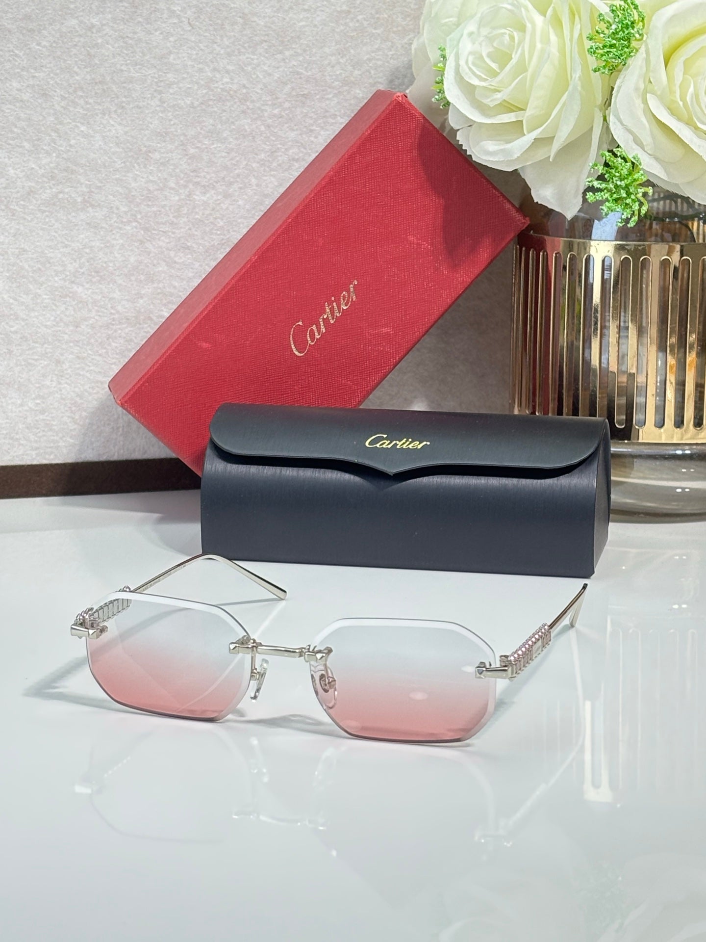 Cartier sunglasses with silver-tone metal frame and pink tinted lenses