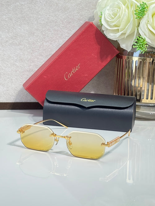 Cartier sunglasses with gold-tone metal frame and yellow tinted lenses