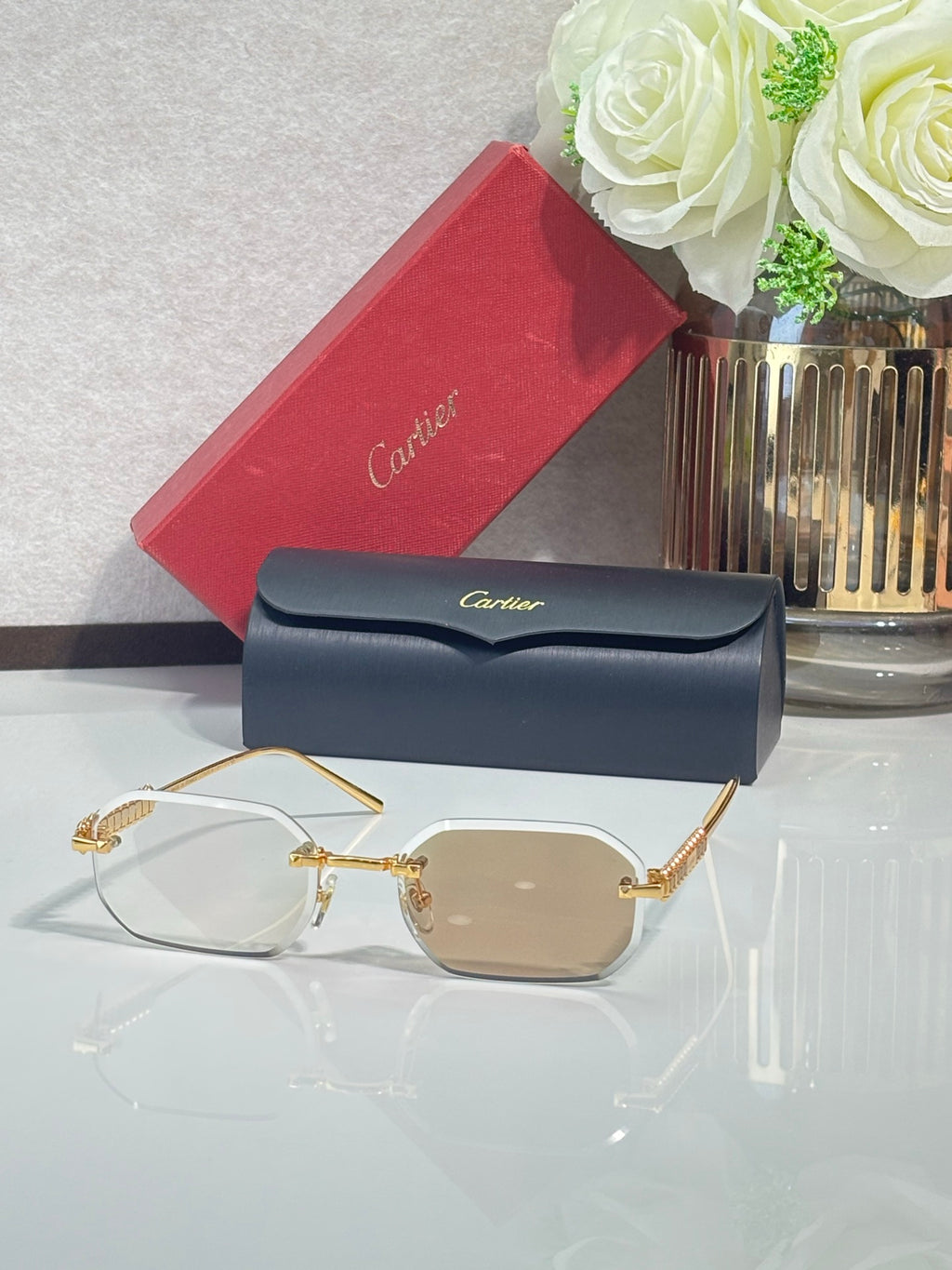 Cartier sunglasses with gold-tone metal frame and beige tinted lenses