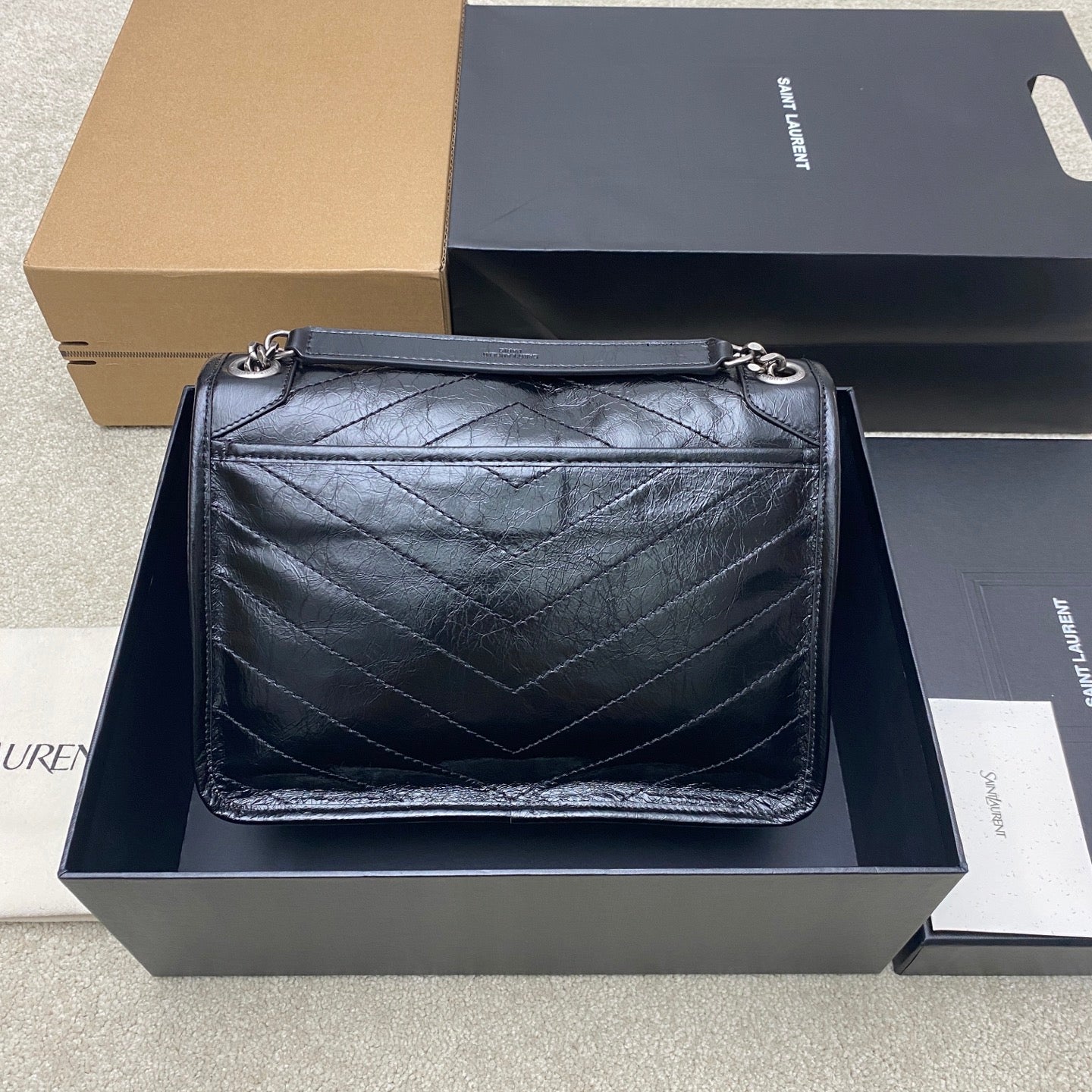 Saint Laurent quilted leather flap shoulder bag with chain strap and YSL logo