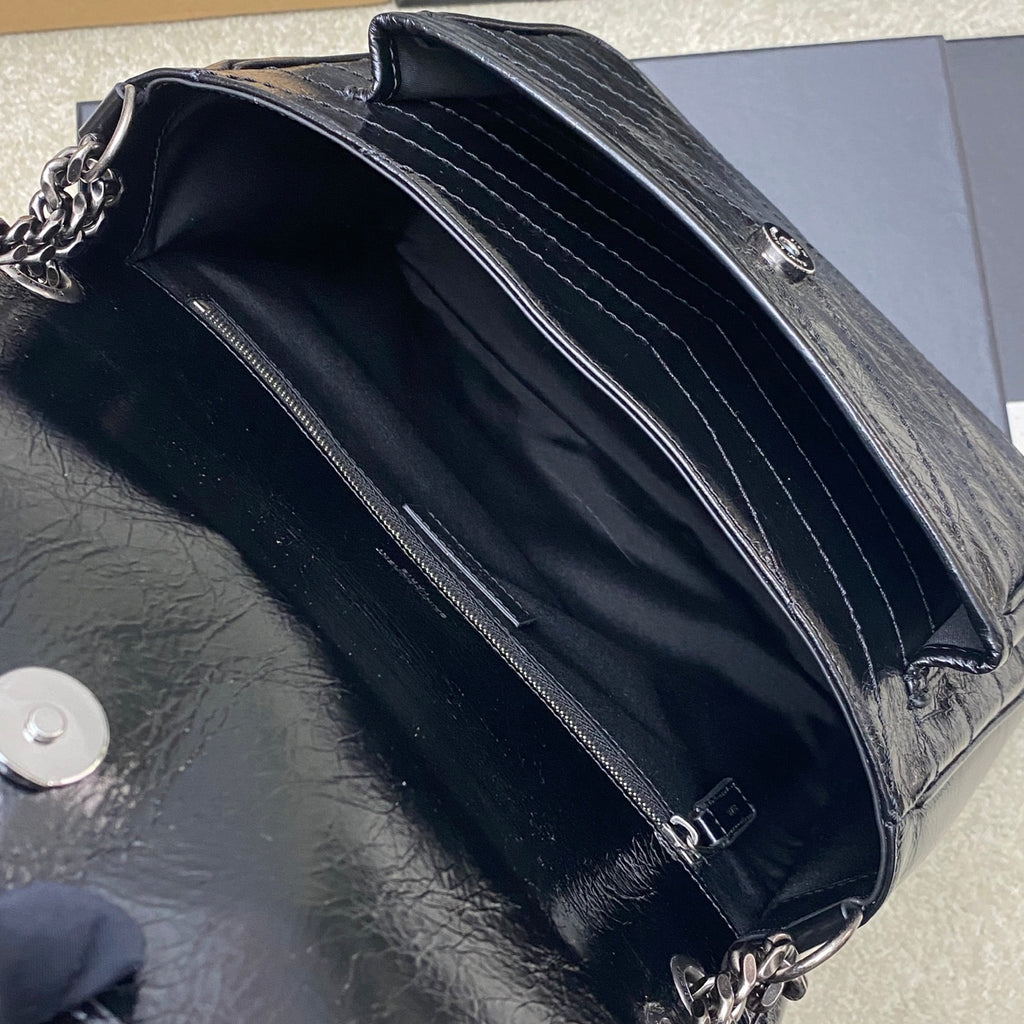 Saint Laurent leather shoulder bag interior with two compartments and zip closure