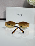 Tortoiseshell and gold sunglasses with amber lenses and curved temple arms