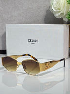 Gold and tortoiseshell sunglasses with amber lenses and ornate side frame