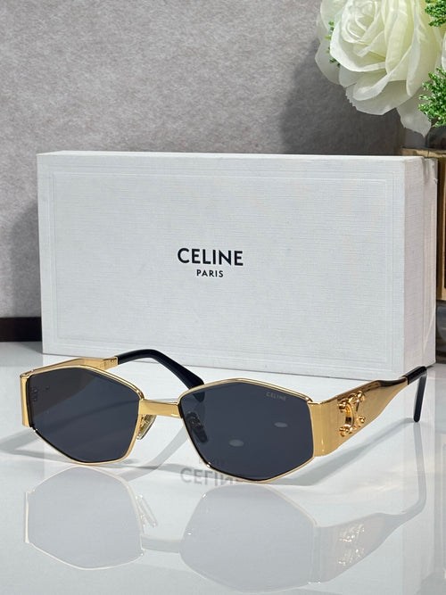Gold and black sunglasses with dark lenses and decorative side details