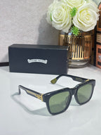 Blue-tinted rectangular sunglasses with green lenses, gold logo detailing