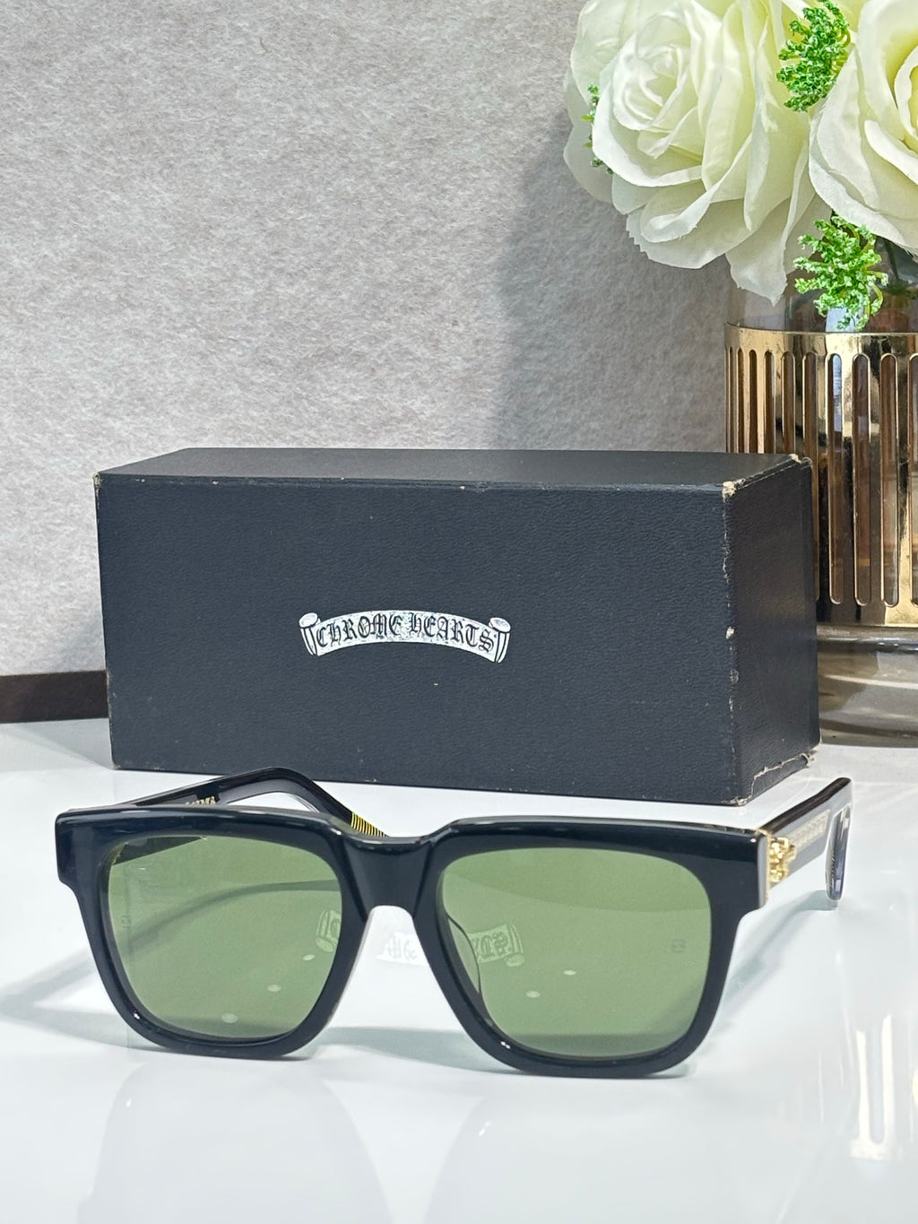 Dark blue rectangular sunglasses with green-tinted lenses and chrome metal temples