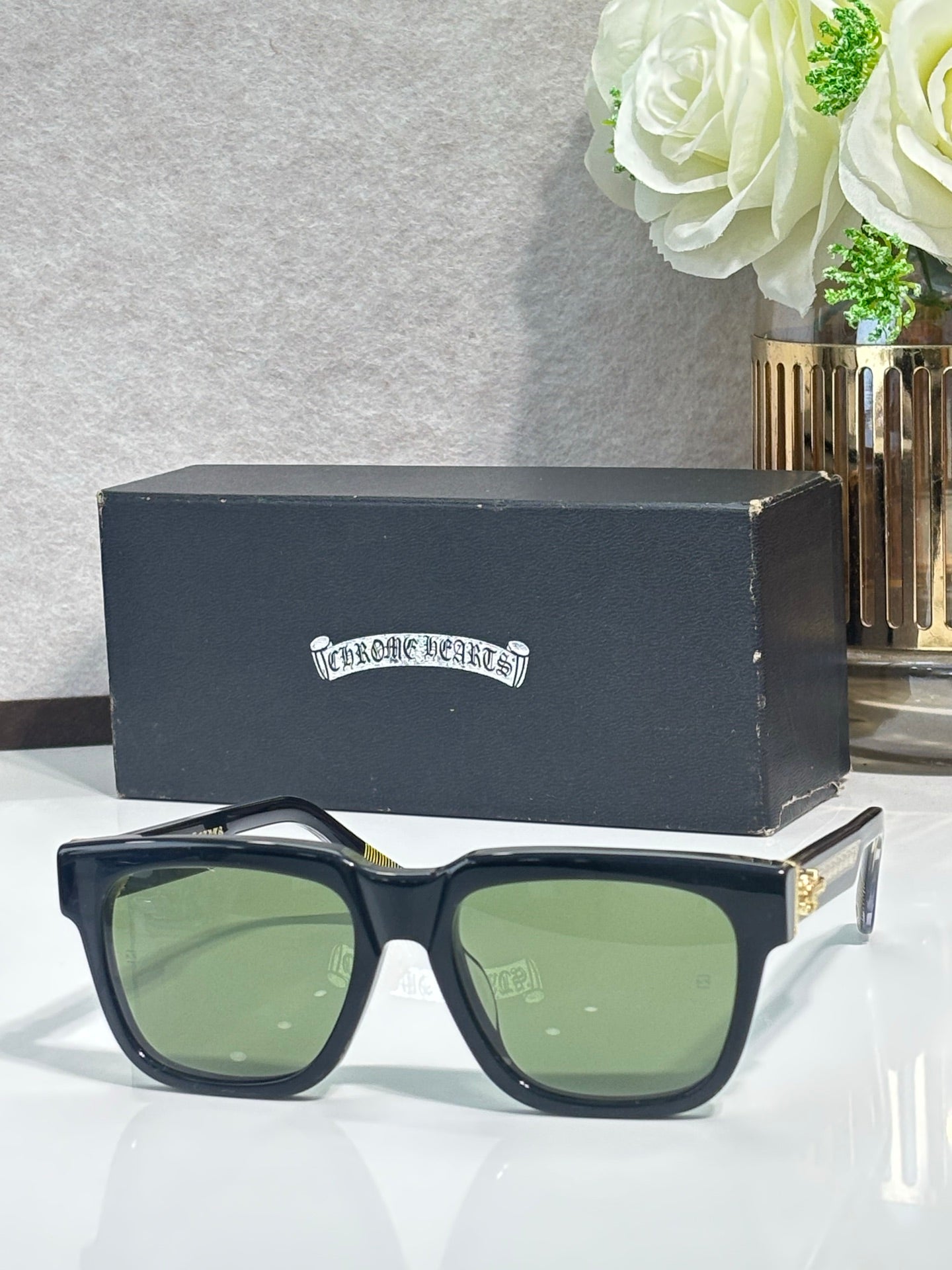 Dark blue rectangular sunglasses with green-tinted lenses and chrome metal temples