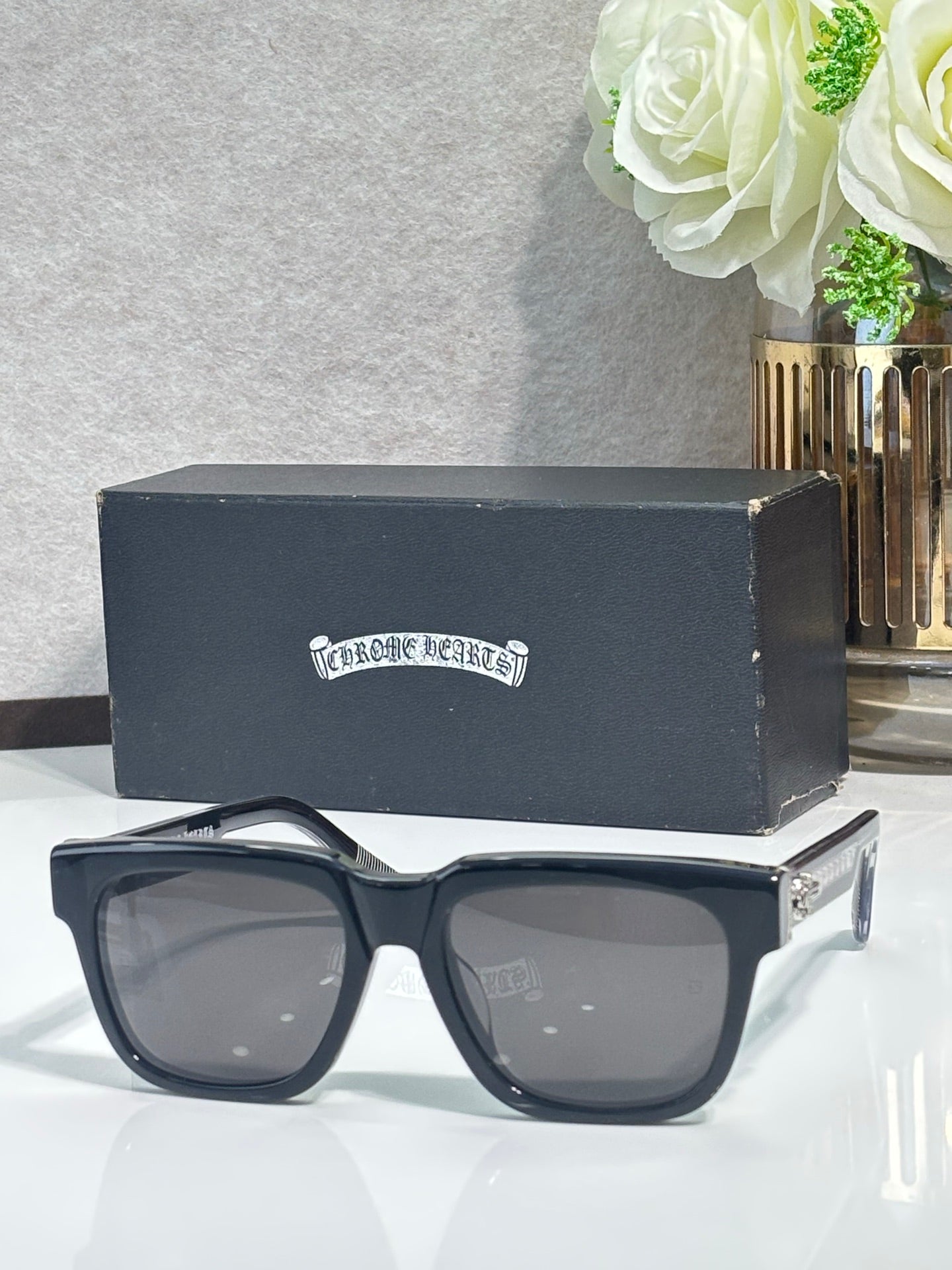 Navy rectangular sunglasses with gray-tinted lenses and chrome metal temples