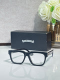 Chrome glasses with dark blue rectangular frames and clear lenses