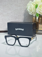 Chrome glasses with dark blue rectangular frames and gold-side details