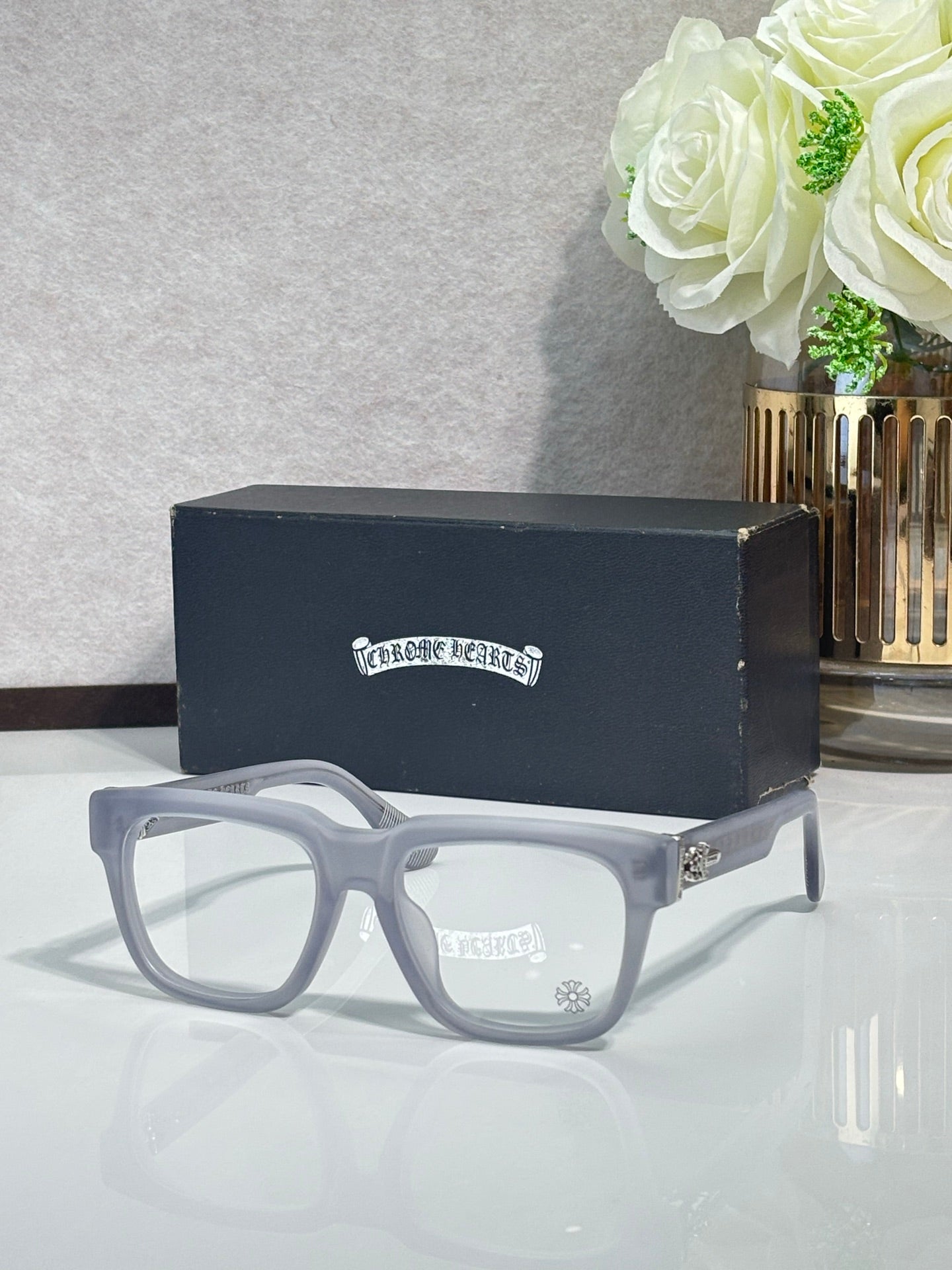 Chrome glasses with light blue rectangular frames and clear lenses