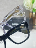 Chrome glasses with chrome rectangular frames and engraved temple design
