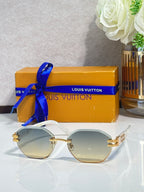 Round sunglasses with light lenses and gold-tone frame details