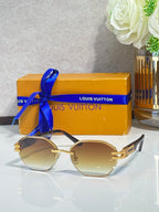 Round sunglasses with light gradient lenses and gold-tone temple accents