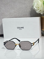 Celine octagonal sunglasses with dark frame, gold accents, and gray lenses, front view