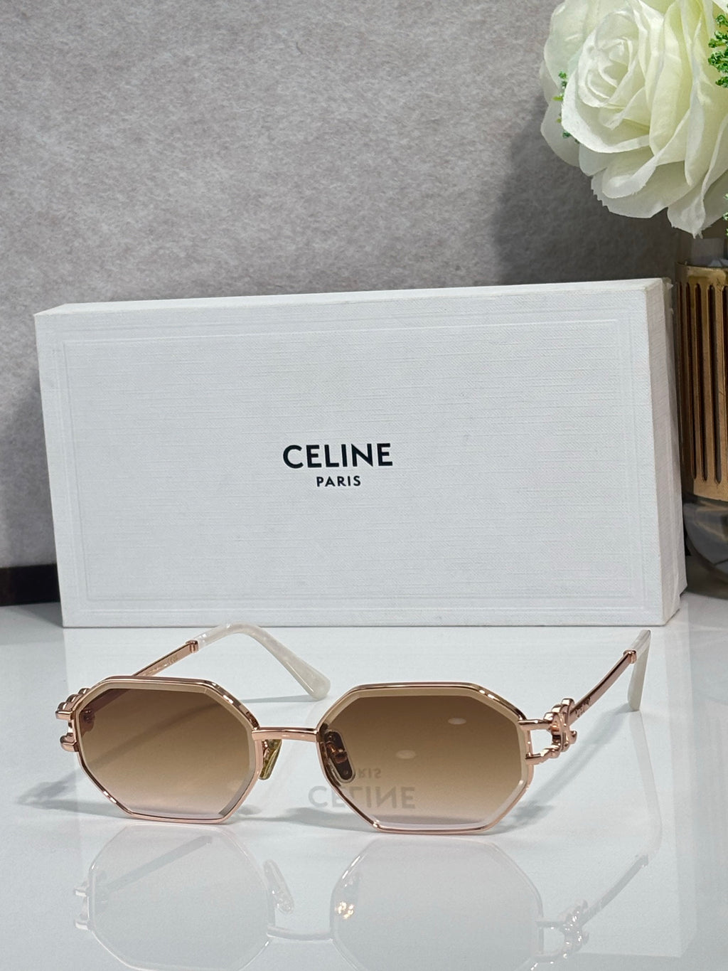 Celine octagonal sunglasses with gold-tone frame and light brown lenses, side view