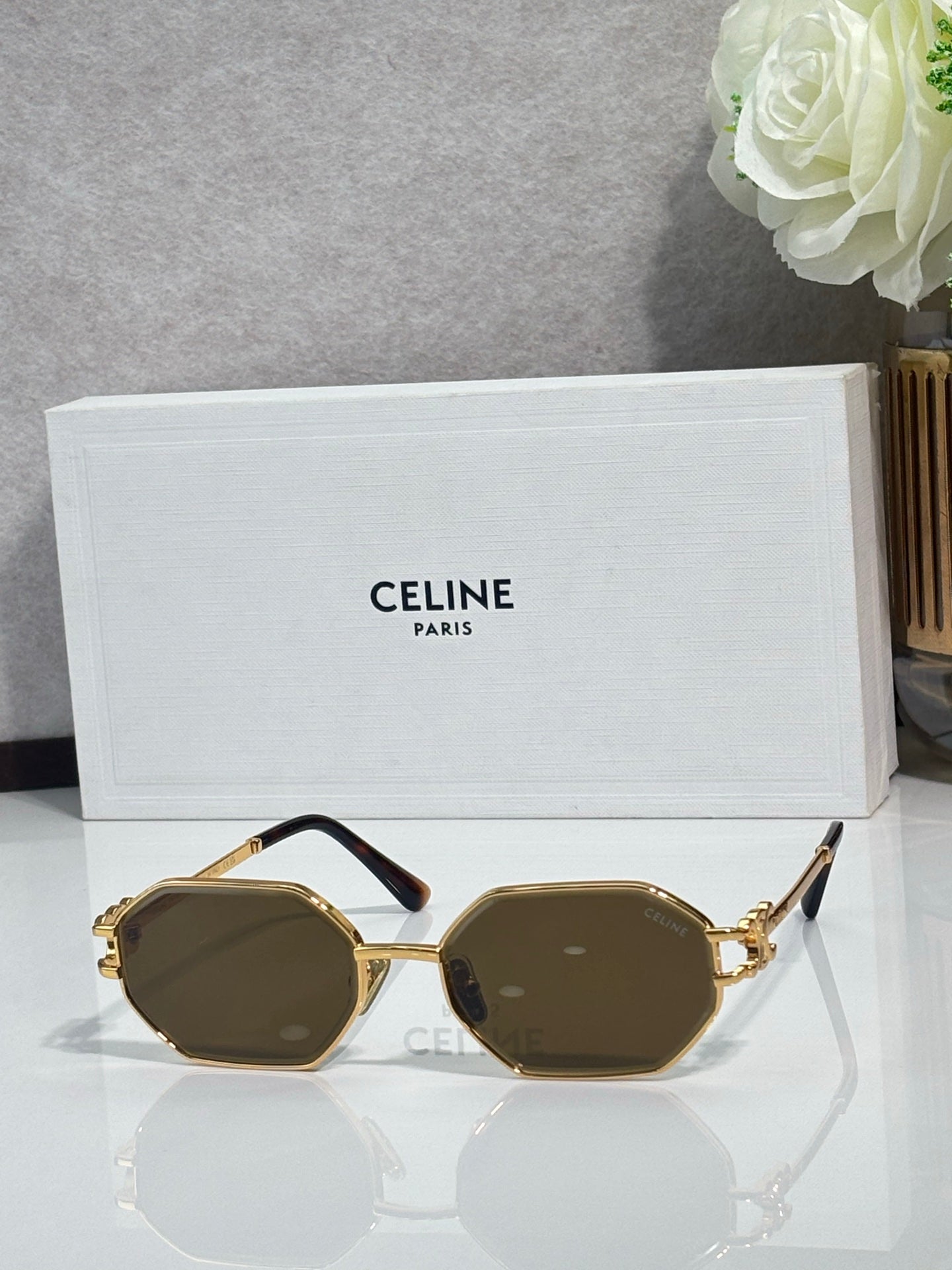 Celine octagonal sunglasses with gold-tone frame and brown lenses, front view