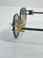 Celine sunglasses with dark frame and gold-tone hinges, side profile