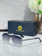 Sunglasses with dark gray frames and gradient blue lenses, metal temple accent