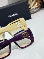 Chanel sunglasses close-up of yellow and purple frames with gold CC emblems
