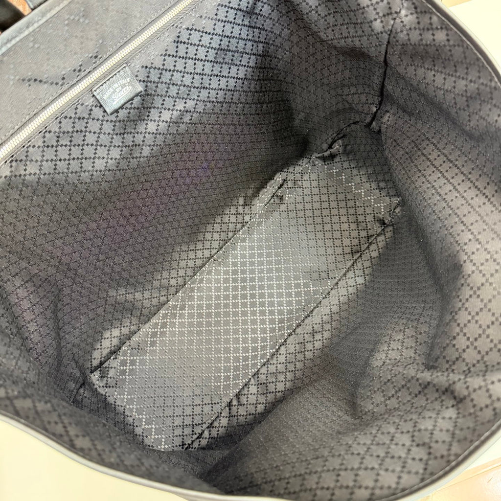 Gucci tote bag interior lining with patterned fabric and inner wall panel stitching