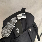 Black pants on hanger with fabric label and drawstring tie