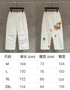 White cargo pants front view and cross-applique side view; size chart shown below