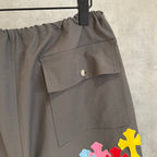 Chrome pants in dark gray with large flap pocket and colorful cross patch