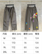 Chrome pants in dark gray, front/back with colorful cross patches; size table