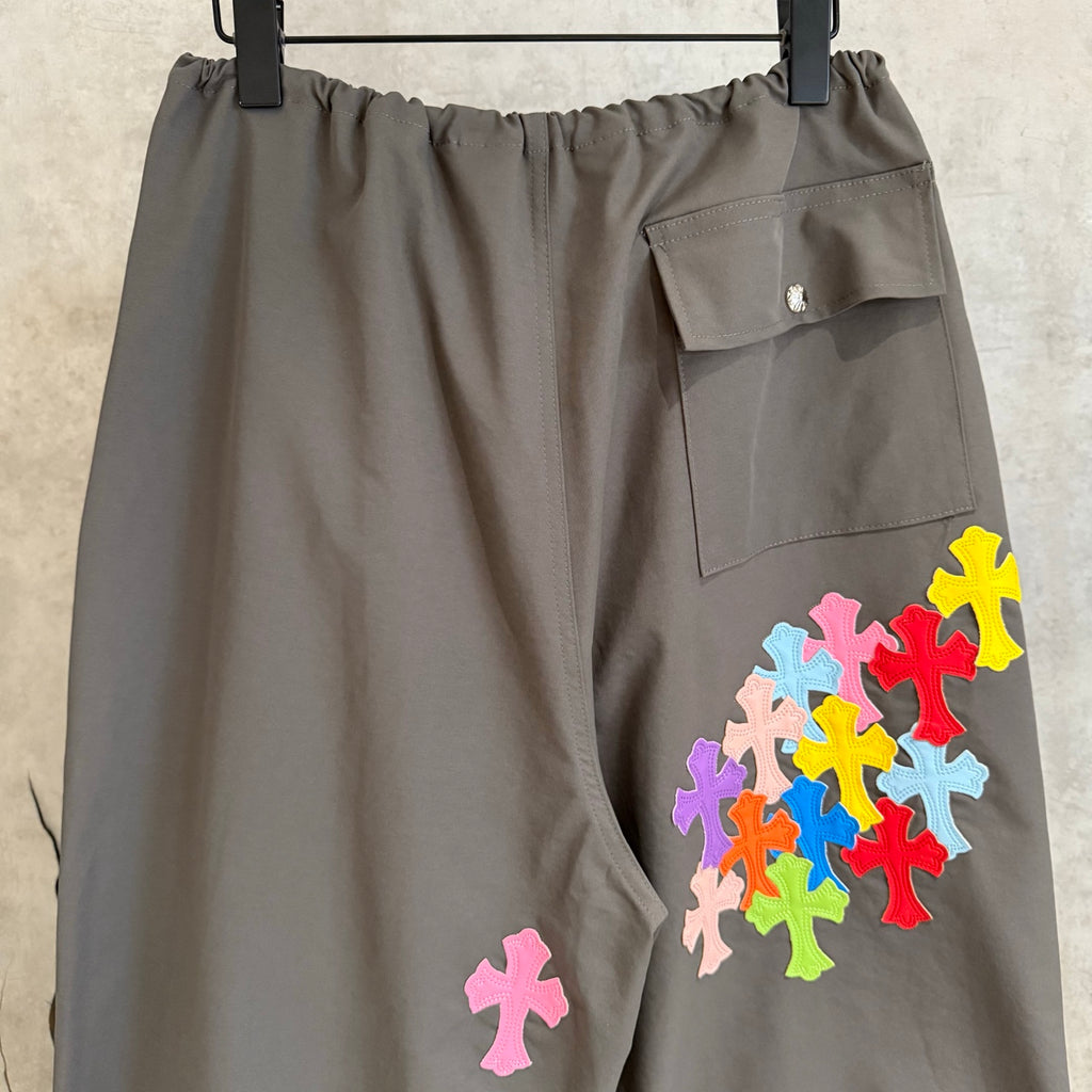 Chrome pants in dark gray with flap pocket and colorful cross appliques