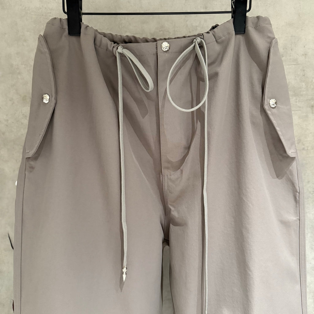 Taupe drawstring pants with front tie and logo snap buttons