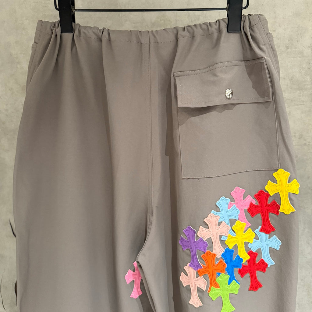 Taupe cargo pants with flap pockets and multicolor cross patch