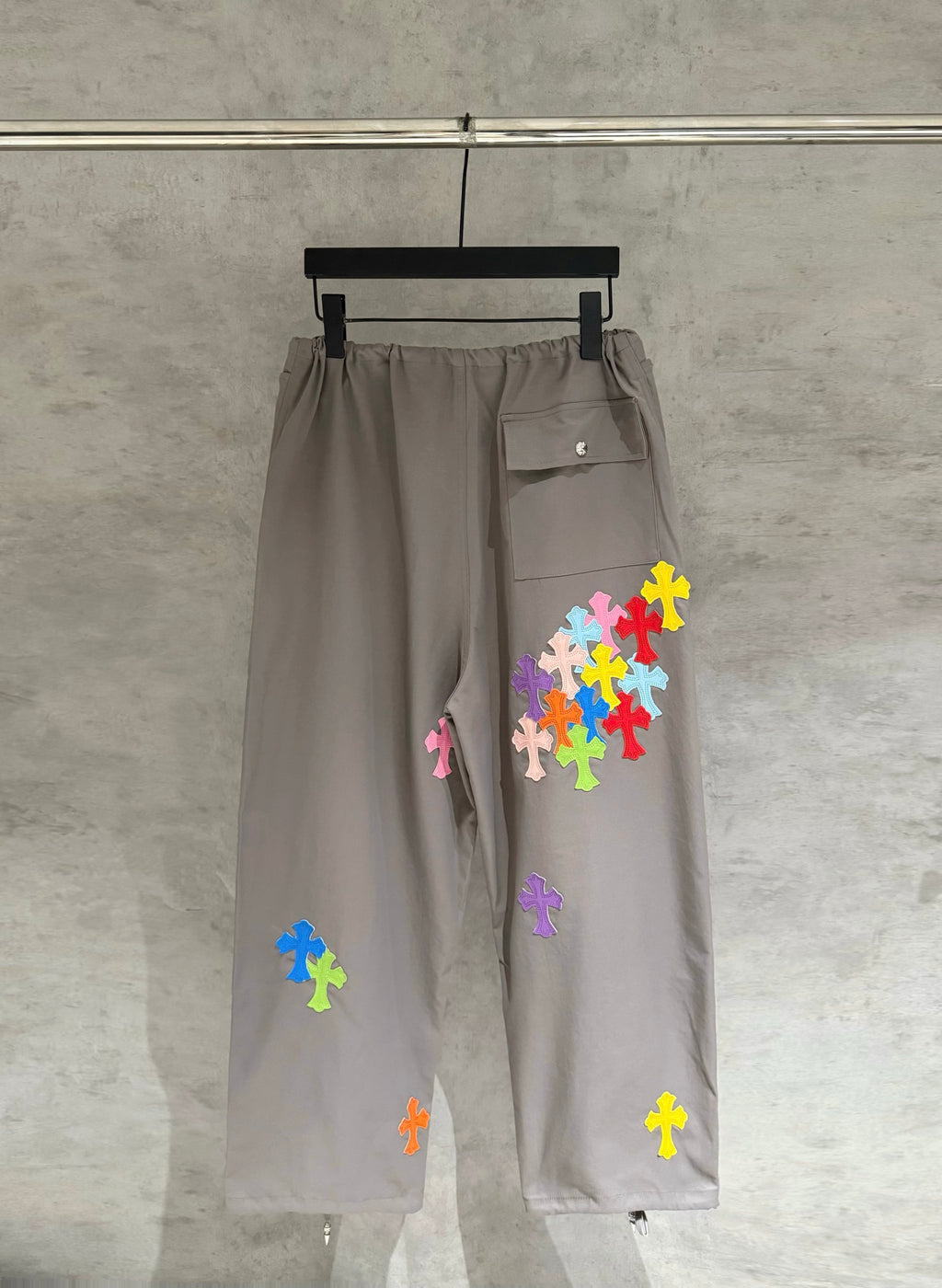 Taupe drawstring cargo pants with multicolor cross patches