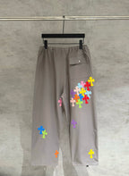 Taupe drawstring cargo pants with multicolor cross patches