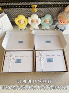 Prada pants packaging boxes with enclosed dust bags and ribbon ties