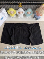 Black shorts front view with belt loops, angled pockets, and zip fly; minimal stitching visible