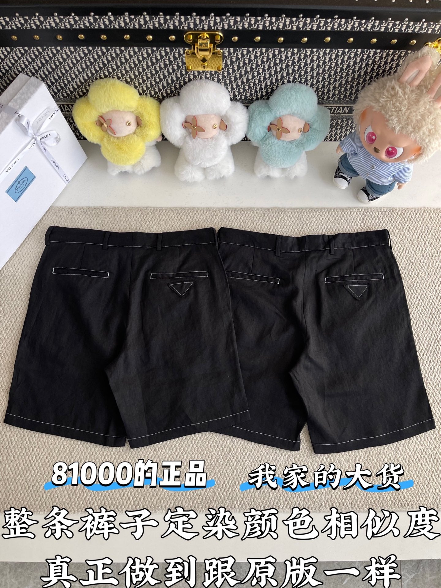 Black shorts front view with belt loops, angled pockets, and zip fly; minimal stitching visible
