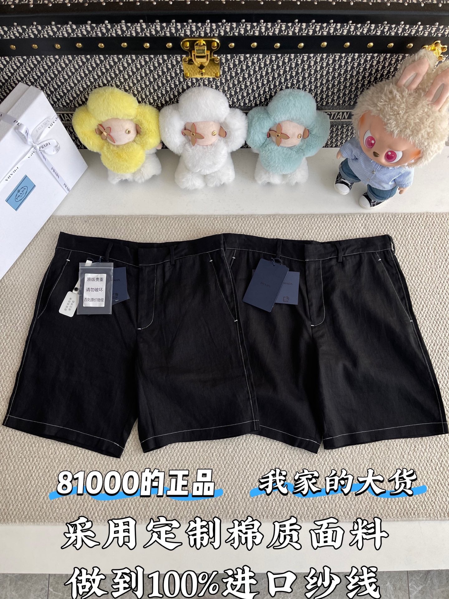 Black shorts with belt loops, front pockets, and zip fly; tags attached at left leg