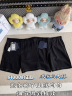 Black shorts laid flat with belt loops, front pockets, and zip fly; size tag on waist
