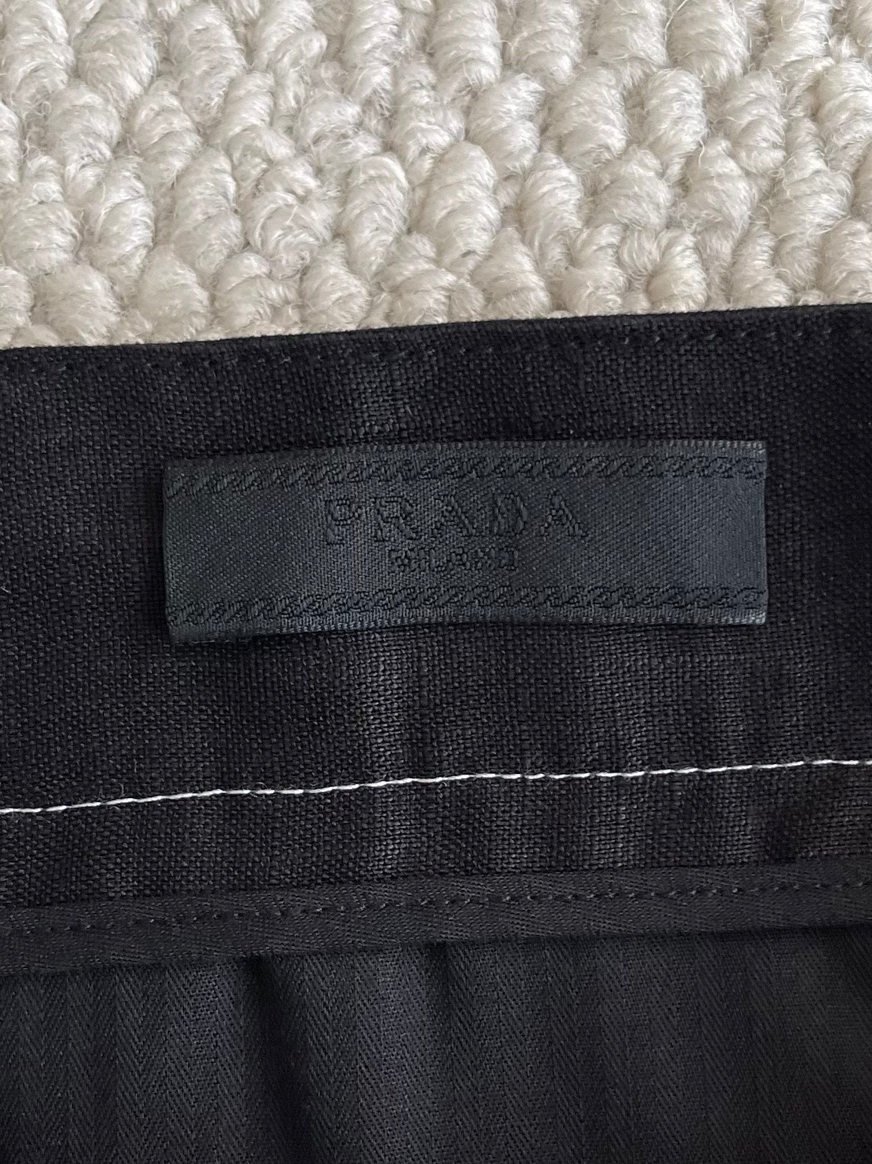 Prada black pants waistband label with embossed logo