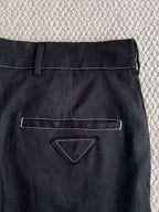Prada black pants close-up of front pocket with triangle stitch detail