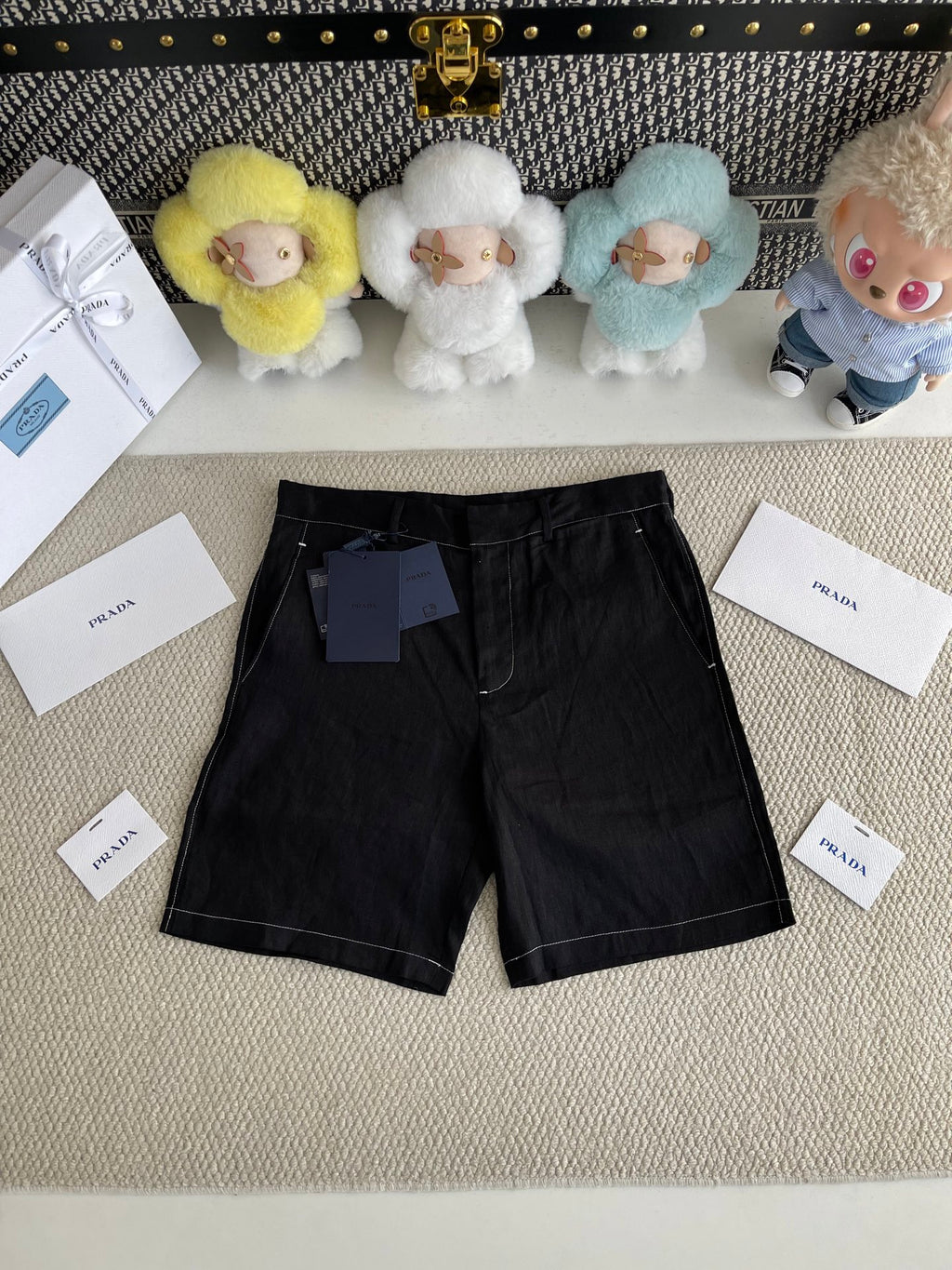 Prada black shorts-style pants with belt loops, zip fly, and two front pockets