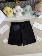 Prada black shorts-style pants with belt loops and zip fly, front view