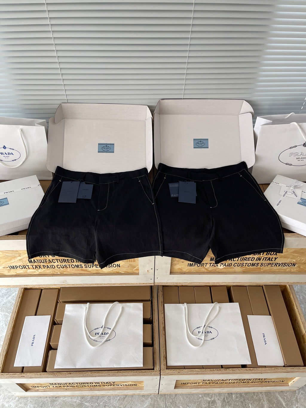 Prada black shorts with belt loops, front zip and button, side pockets