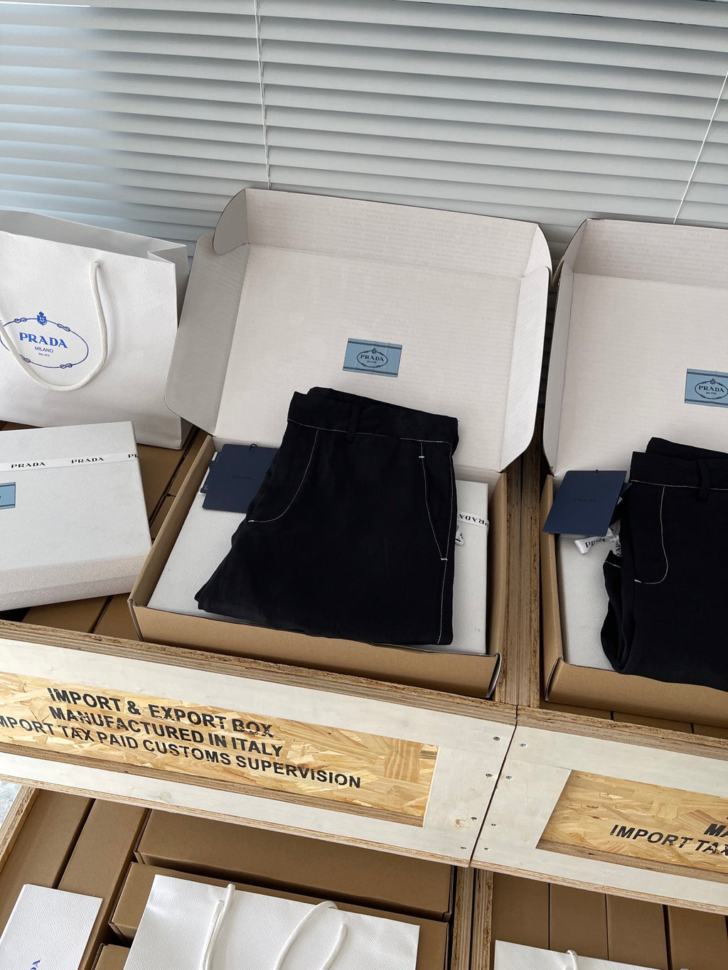 Prada black shorts in box, folded front with side pockets and zip fly