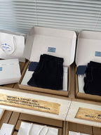 Prada black shorts in box, folded front with side pockets and zip fly